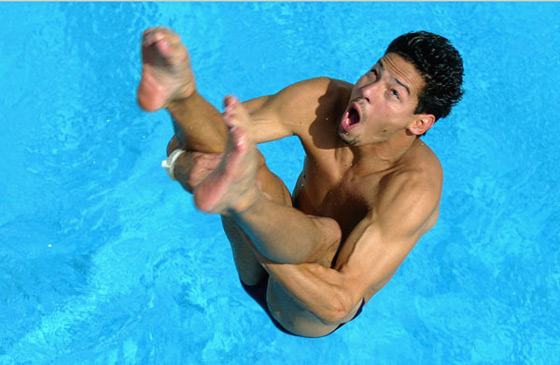 Puerto Rican Olympic Diver, Mark Ruiz splashes into pool